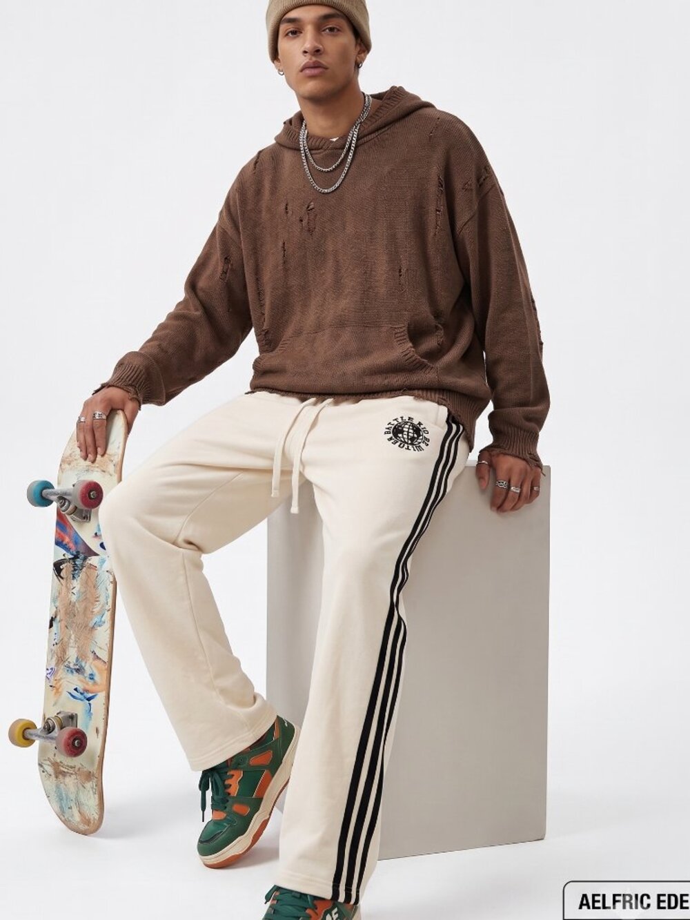AELFRIC EDEN UNISEX CREAM JOGGERS WITH BLACK STRIPES AND EMBROIDERY